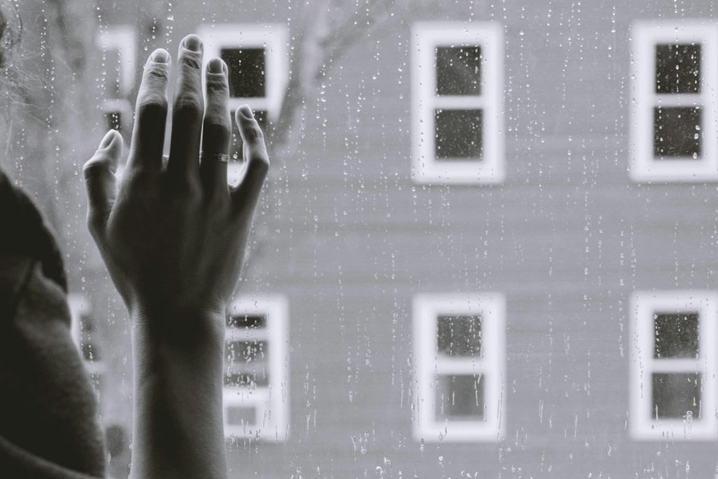 person with Major Depressive Disorder looking out window